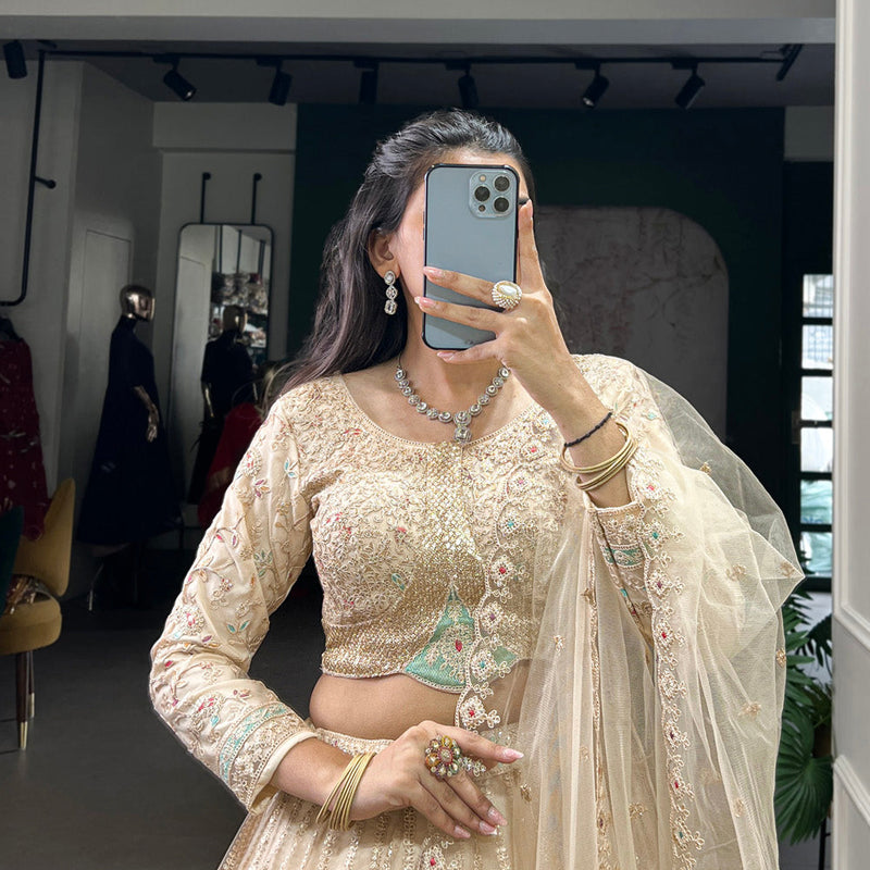 Cream Color Sequins And Thread Embroidery Work Net Lehenga Choli